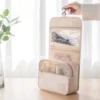 beige hanging toiletry cosmetic bags – travel-size makeup organizer with hook.